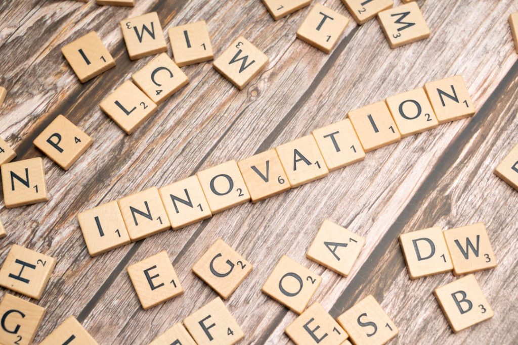 Home scrabble-tiles-spelling-the-word-innovation-on-a-wooden-surface-qjoxrwxtarm